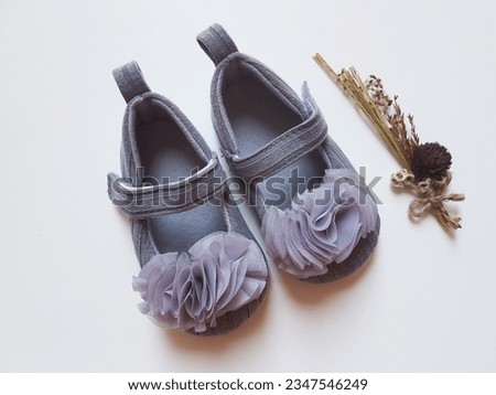 Baby shoes on a white background.
