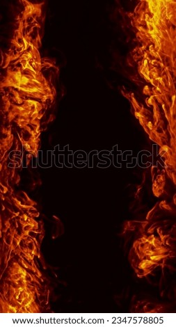 Burning background. Fire heat. Hot blaze. Orange red color light warm flame blast texture frame on dark night black abstract copy space.