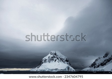 Cool pastel light, before dawn; Antarctica; Cornwallis Island, cloudscape panorama; Antarctic Peninsula; Diagonal cloud,  Antarctic Peninsula; Dichotomous berg, at dawn; Antarctica Bay