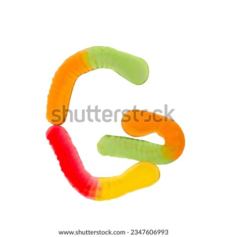 Letter G made of multicolored gummi worms and isolated on pure white background. Food alphabet concept. One letter of the set of sweet food font easy to stacking