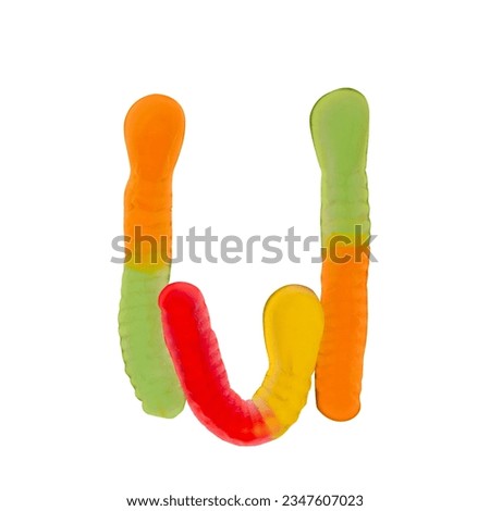 Letter U made of multicolored gummi worms and isolated on pure white background. Food alphabet concept. One letter of the set of sweet food font easy to stacking