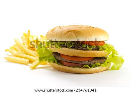 Big and tasty hamburger and fried potatoes isolated on white background