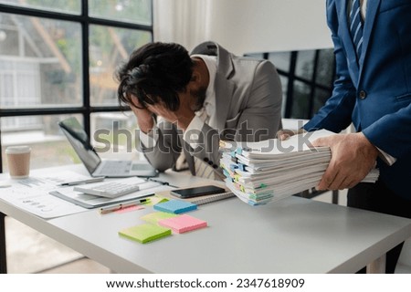 Company employees are doing stressful gestures due to heavy workload, hard work, businessman with a lot of documents. The concept of hard work of company employees.