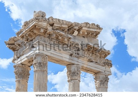 The Temple of Trajan in Pergamon Ancient City. Entablature of the ruined temple with a stone-cut relief on the frieze. Close up fragment. History, art or architecture concept. Bergama, Turkey Royalty-Free Stock Photo #2347628415