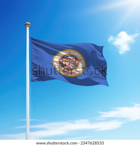 Waving flag of Minnesota is a state of United States on flagpole with sky background.