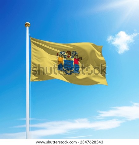 Waving flag of New Jersey is a state of United States on flagpole with sky background.