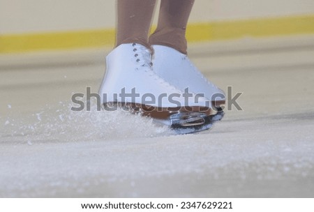 children ice skating on ice skates in winter, activity and exercise on ice
