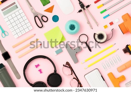 Stationary, school supplies flat lay. Back to school flat lay on pink background Royalty-Free Stock Photo #2347630971