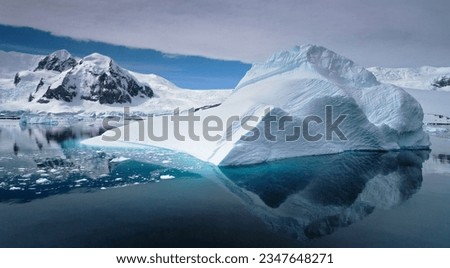 Shadowed bergs, sunlit mountains; Winter camp, photographed, typically bad, summer weather; Elephant Island; Sea ice before Cape, Well-Met waterfalls; Antarctic Peninsula, Sculpted berg; Antarctic Bay