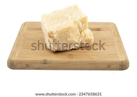 Grana Padano Parmesan cheese on a wooden board Royalty-Free Stock Photo #2347658631