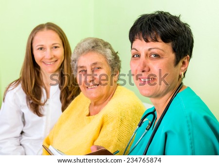 Photo of happy elderly woman with her daughters