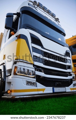 Truck, tuned with white and yellow coloring. Royalty-Free Stock Photo #2347678237
