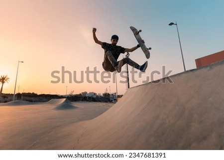 young man skates in a skate park at sunset y Gran Canaria. Canary Islands
