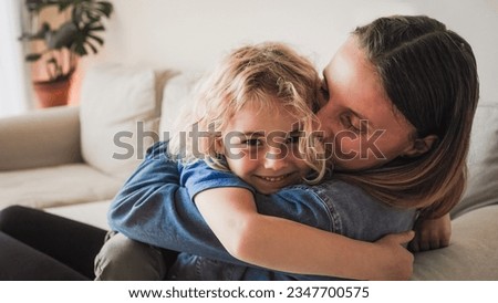 Happy mother and son hugging each other and having fun at home - Family love concept - Soft focus on mom head Royalty-Free Stock Photo #2347700575