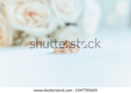 a wedding ring and a a bouquet
