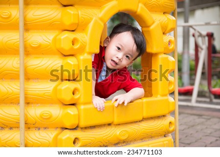 Happy little three years old child. A very cute young boy looking at camera. Image of funny and joyful beautiful little kid on a playground. Happy childhood, healthy and happiness concept.