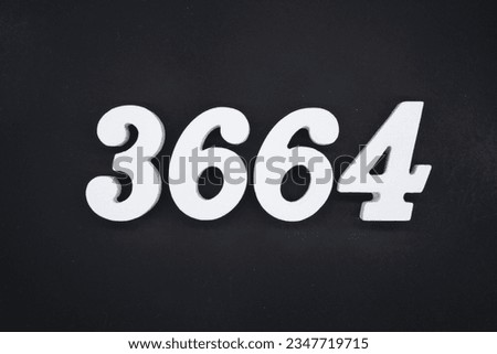 Black for the background. The number 3664 is made of white painted wood.