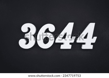 Black for the background. The number 3644 is made of white painted wood.