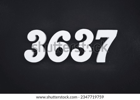 Black for the background. The number 3637 is made of white painted wood.