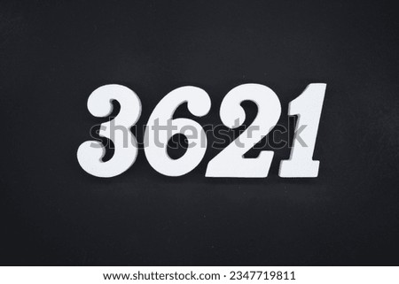Black for the background. The number 3621 is made of white painted wood.