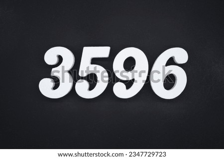 Black for the background. The number 3596 is made of white painted wood.