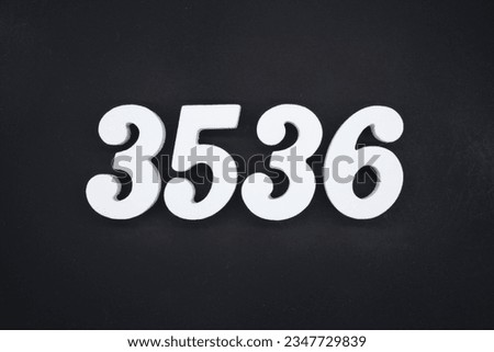 Black for the background. The number 3536 is made of white painted wood.