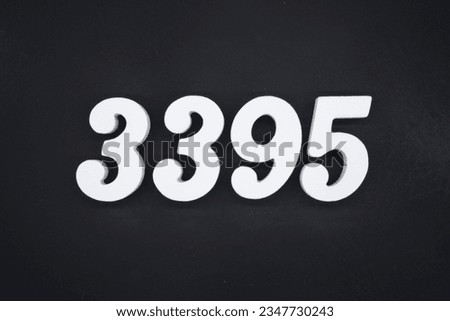 Black for the background. The number 3395 is made of white painted wood.