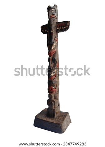 Totem pole , Memorial symbol with a large carved wooden sculpture. It is part of the indigenous culture that is present in the Indian tribes. The northwest coast of North America Royalty-Free Stock Photo #2347749283