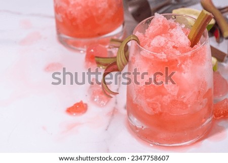 Refreshing summer rhubarb sour fizz cocktail,  frozen fizz cocktail, sweet rhubarb slushy with sirup, rum and champagne. Refreshing cold and healthy summer cocktail Royalty-Free Stock Photo #2347758607