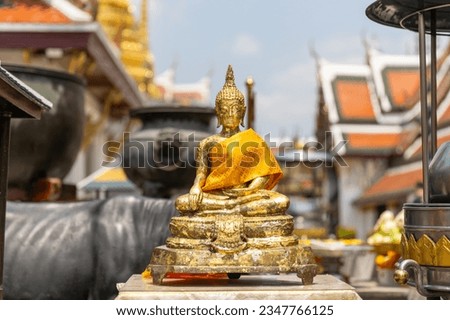 Buddha golden statue in the park of the Royal Family in Bangkok