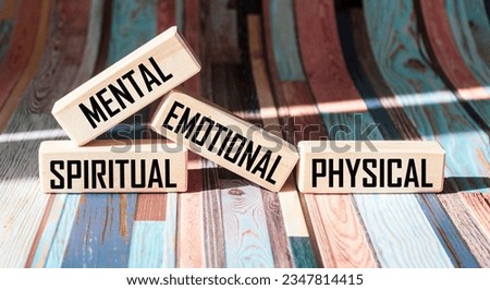 Mental Spiritual Emotional Physical written on wooden blocks and vintage background Royalty-Free Stock Photo #2347814415