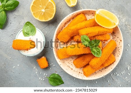 crispy fish steak, fish fingers served with tar tar sauce on a light background. banner, menu, recipe place for text, top view. Royalty-Free Stock Photo #2347815029