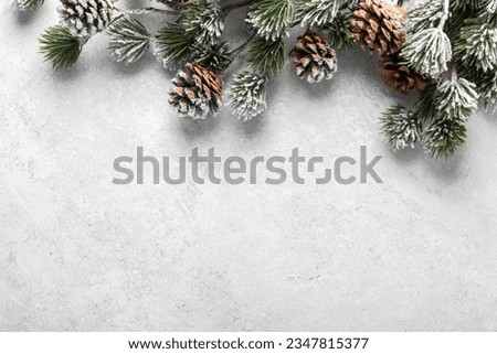Merry Christmas and Happy Holidays greeting card, frame, banner. New Year. Noel. Snow christmas tree light background. Winter xmas holiday theme. Flat lay	 Royalty-Free Stock Photo #2347815377