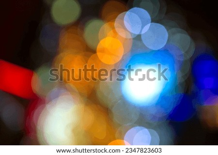 background blurred abstraction of colored lanterns and decorations. bokeh texture of street colored lights