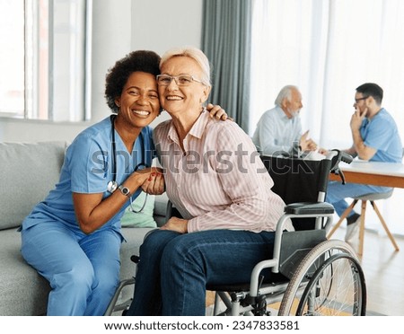 Doctor or nurse caregiver helping  senior woman in a wheelchair at home or nursing home, person with paraplegia, people with chronic health condition, person with disability Royalty-Free Stock Photo #2347833581