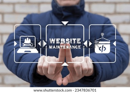 Web programmer using virtual touch screen presses inscription: WEBSITE MAINTENANCE. Website under construction page. Web site under maintenance page. Web Page Under maintenance.