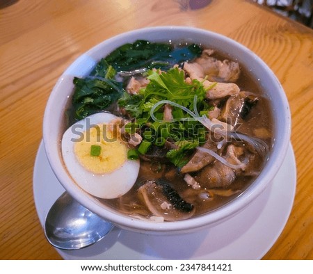 selective focus picture of glass noodles ramen with egg 