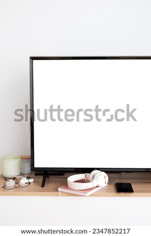 TV led mock up screen. Smart TV in living room interior. Blank screen television on wooden table at living room, copy space for text on TV.