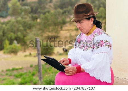 Indigenous woman using a tablet Royalty-Free Stock Photo #2347857107
