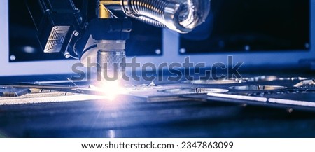 Metallurgy milling plasma cutting of metal CNC Laser engraving. Concept background modern industrial technology banner, blue toning. Royalty-Free Stock Photo #2347863099
