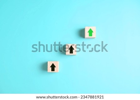 wooden block with upper arrow screen on wooden. Upper arrow with clean background.