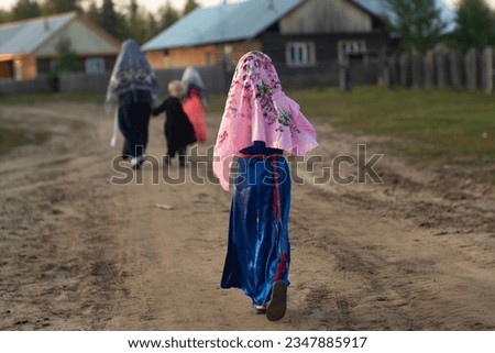 Old Believers of the Russian Church in the Krasnoyarsk Territory, a girl in a national costume. 
The village of Sandakches. Royalty-Free Stock Photo #2347885917