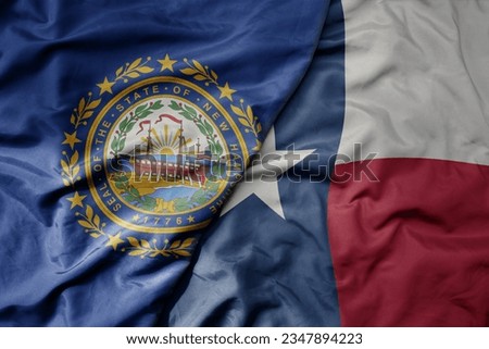 big waving colorful national flag of texas state and flag of new hampshire state . macro