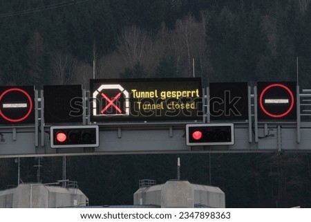 a closed car tunnel sign in road traffic and transportation