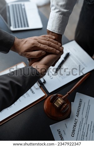 The handshake after a good cooperation, consulting between attorney and client, businessman, tax and real estate project company. Law and justice concept