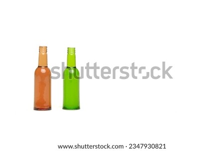 A picture of empty glass bottle on copyspace white background. Glass bottle recycle concept.