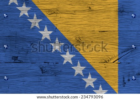 Bosnia and Herzegovina  national flag. Painting is colorful on wood of old train carriage. Fastened by screws or bolts.