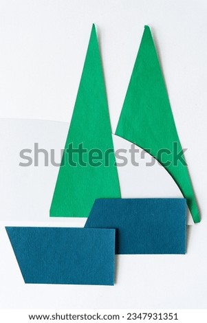 abstract paper shapes or stylized boat floating in white space