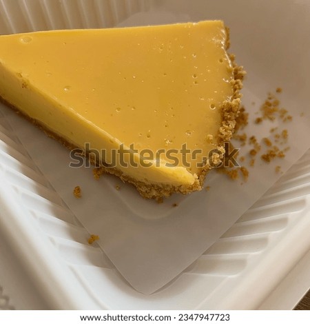 cheese pie on a pink table, ready to enjoy dessert with ground biscuit base, mexico latin america
