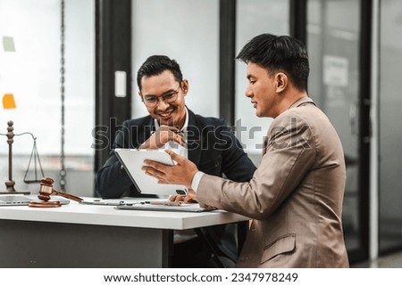 Two disgusting businessmen Asian lawyer of Indian descent paying attention to mistakes, proposing corrections. Businessman discussing contract policy terms with client, rights of liberty concept.
